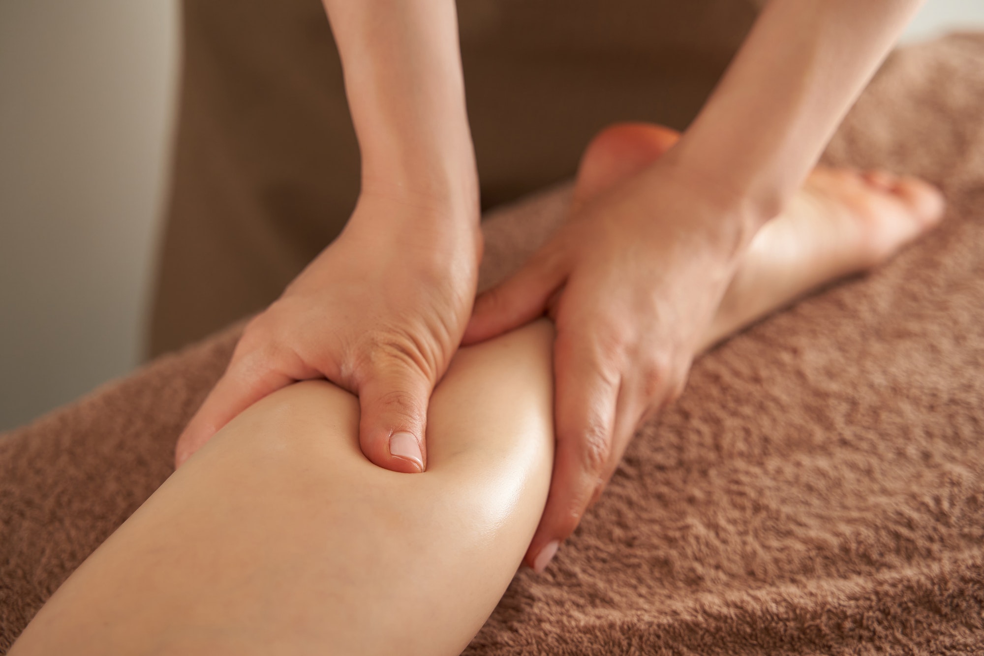 Japanese woman getting a foot massage at an aesthetic salon